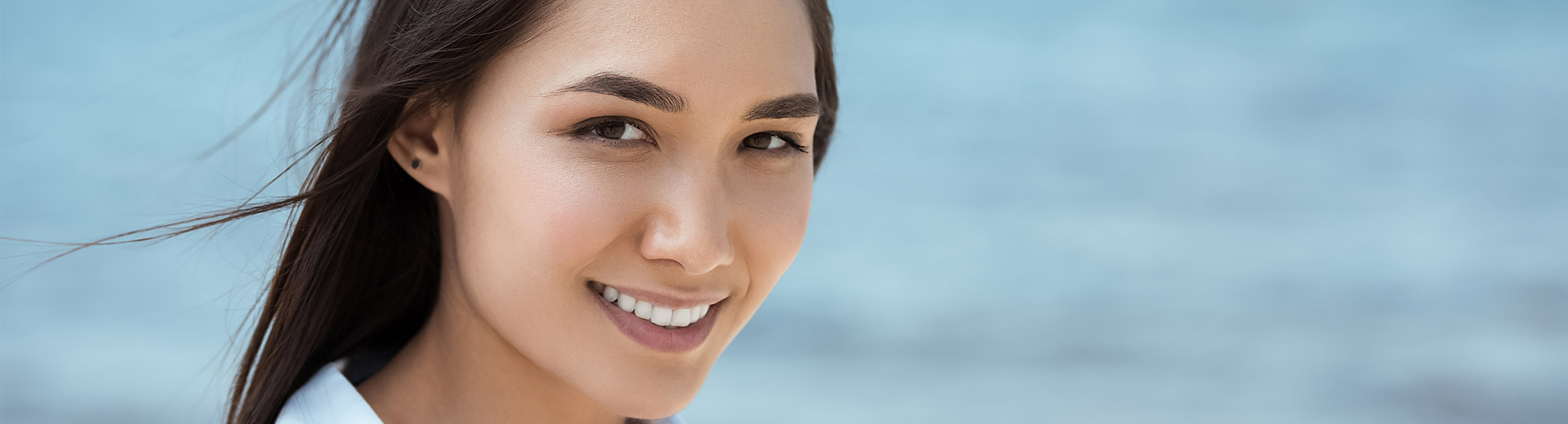 A beautiful woman is after cosmetic dentistry.