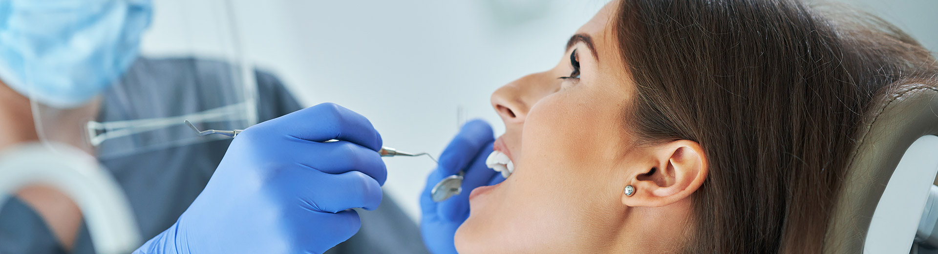 A patient is receiving dental implants.